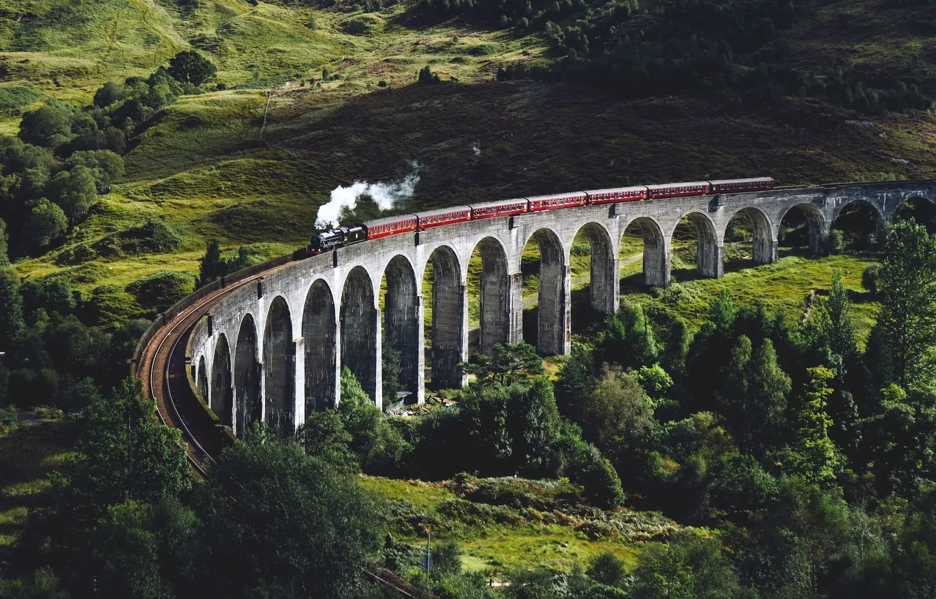 A picture of a train going across a bridge